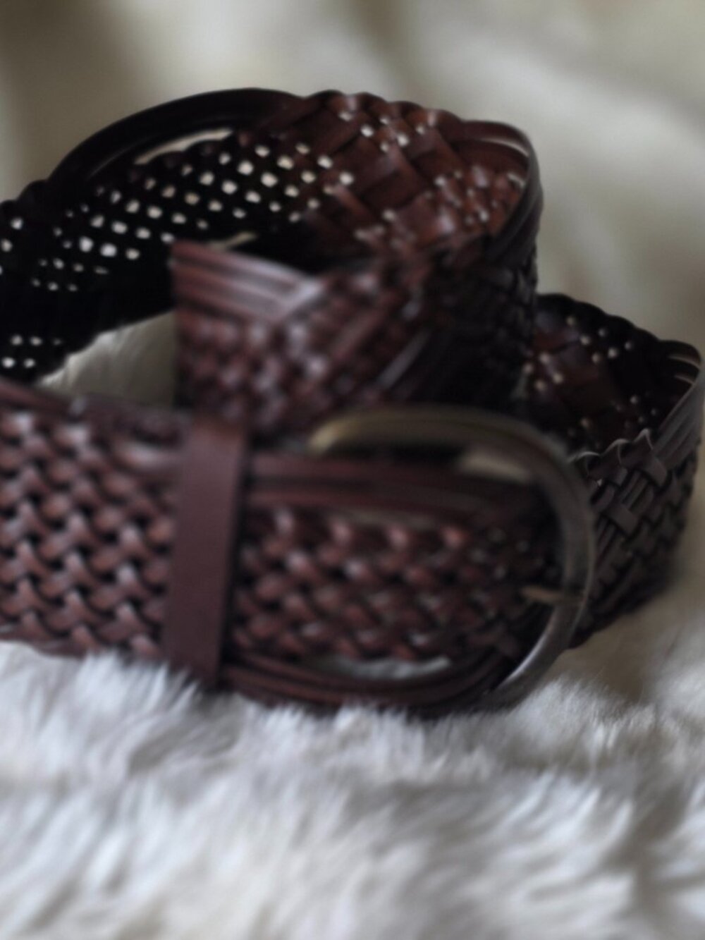 Wide woven brown leather belt with large brass tone buckle